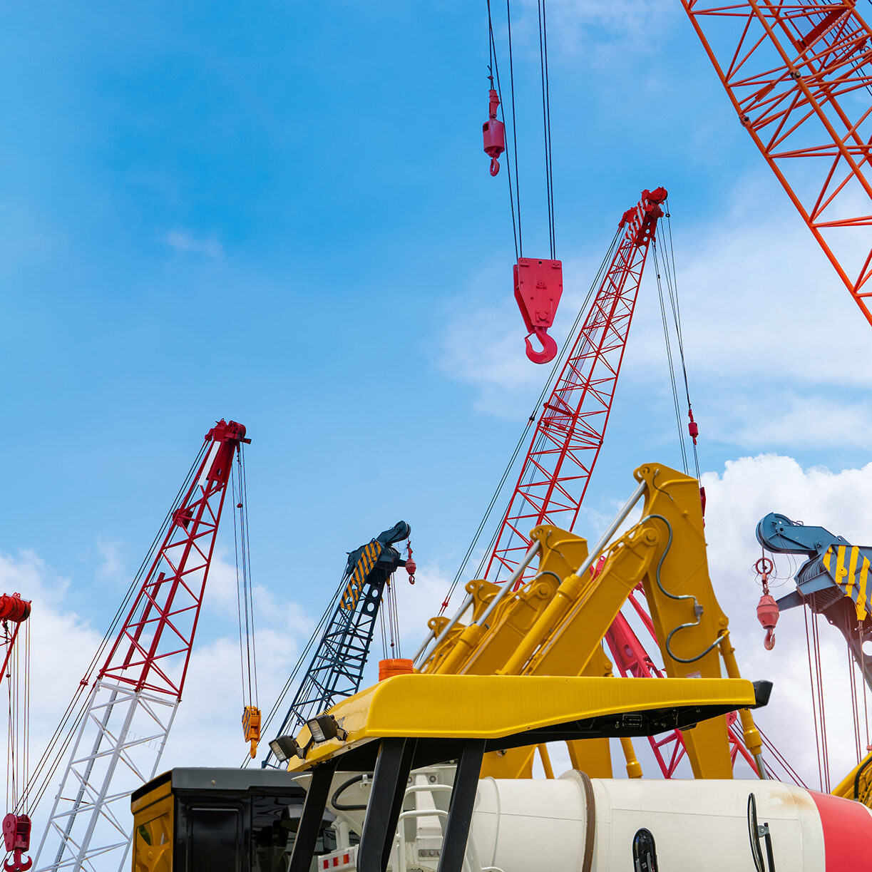 Crawler crane against blue sky.