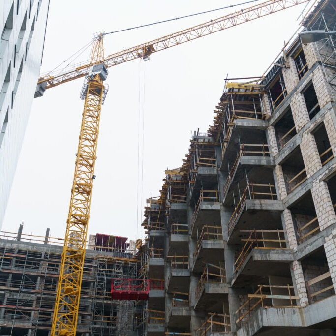 Construction crane on the background of a construction site.